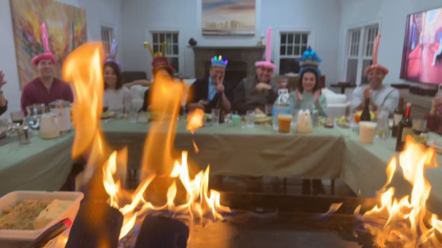 Grilled steak being prepared on mobile hibachi grill in Boston