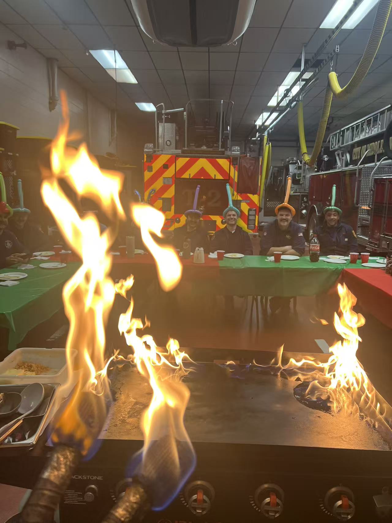 Happy customers enjoying hibachi meal at Boston outdoor party