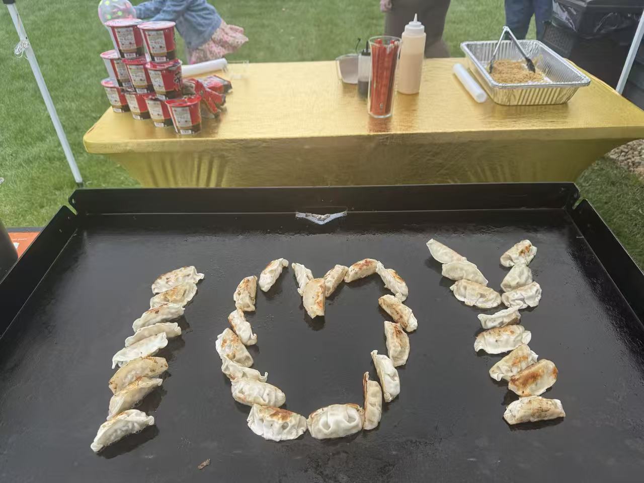 Guests enjoying mobile hibachi dinner in New England