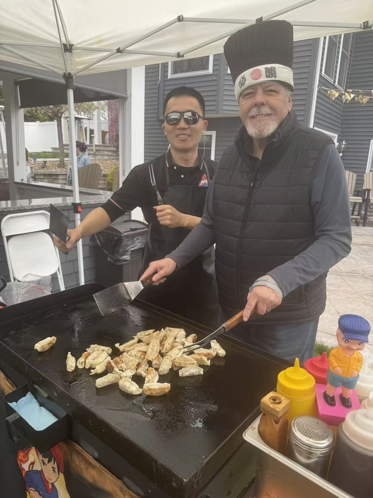 Hibachi grill cooking steak and shrimp at New England event