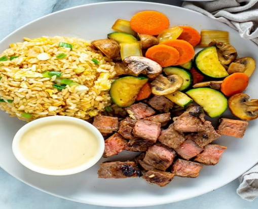HibachiEpic hibachi food preparation - fresh proteins and vegetables cooked on grill
